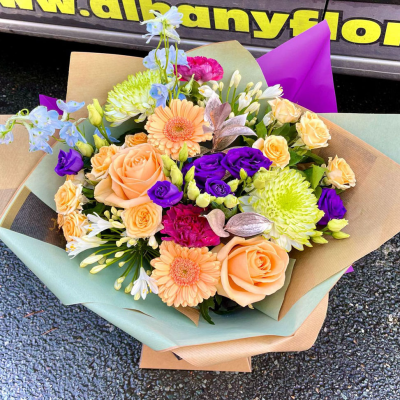 Peach Sorbet - Soft peach roses, vibrant lisianthus and seasonal blooms come together in this fresh and uplifting bouquet beautifully created by Albany Florists.