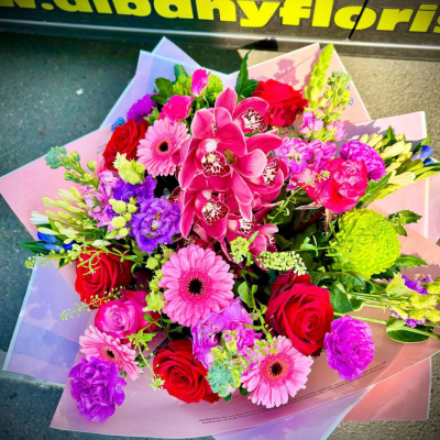 Orchid Kiss - An eye-catching luxury bouquet featuring vibrant cymbidium orchids, roses and premium seasonal flowers beautifully arranged by Albany Florists. Exotic, elegant and designed to steal the spotlight.