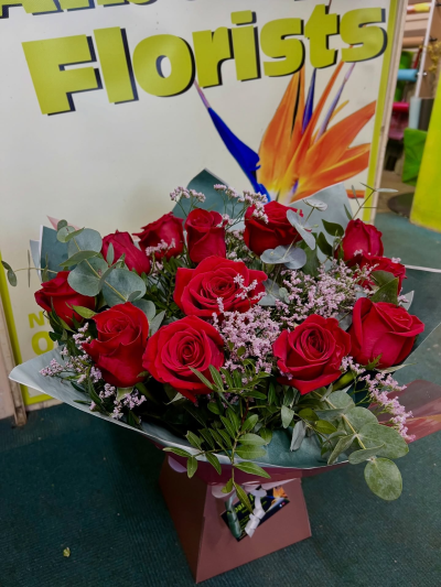 Red Roses - Beautiful red roses with lush green foliage